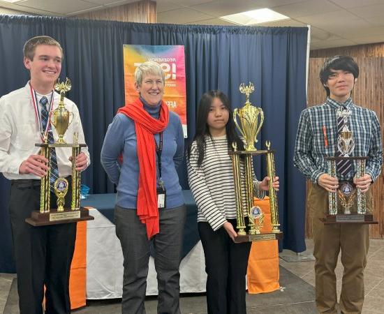 Provost Stephanie Nesbitt stands with winners of the 2024 Regional Science Fair.